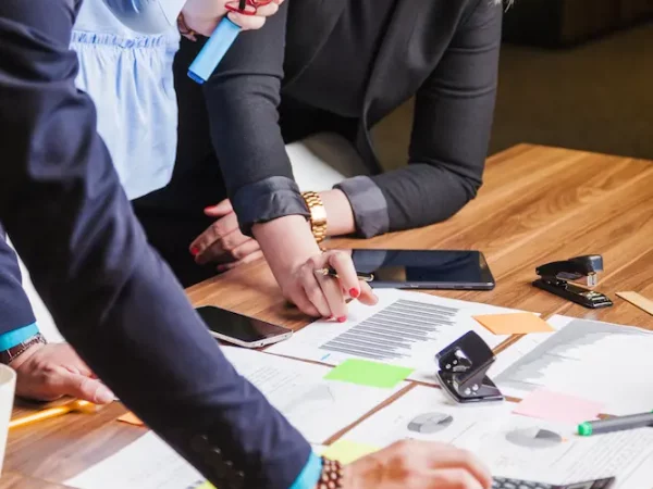 people-leaning-desk-standing